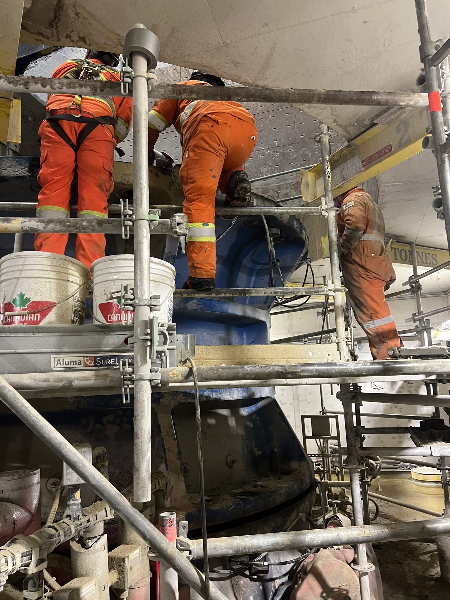 JTR crew members working from scaffold inside an industrial plant