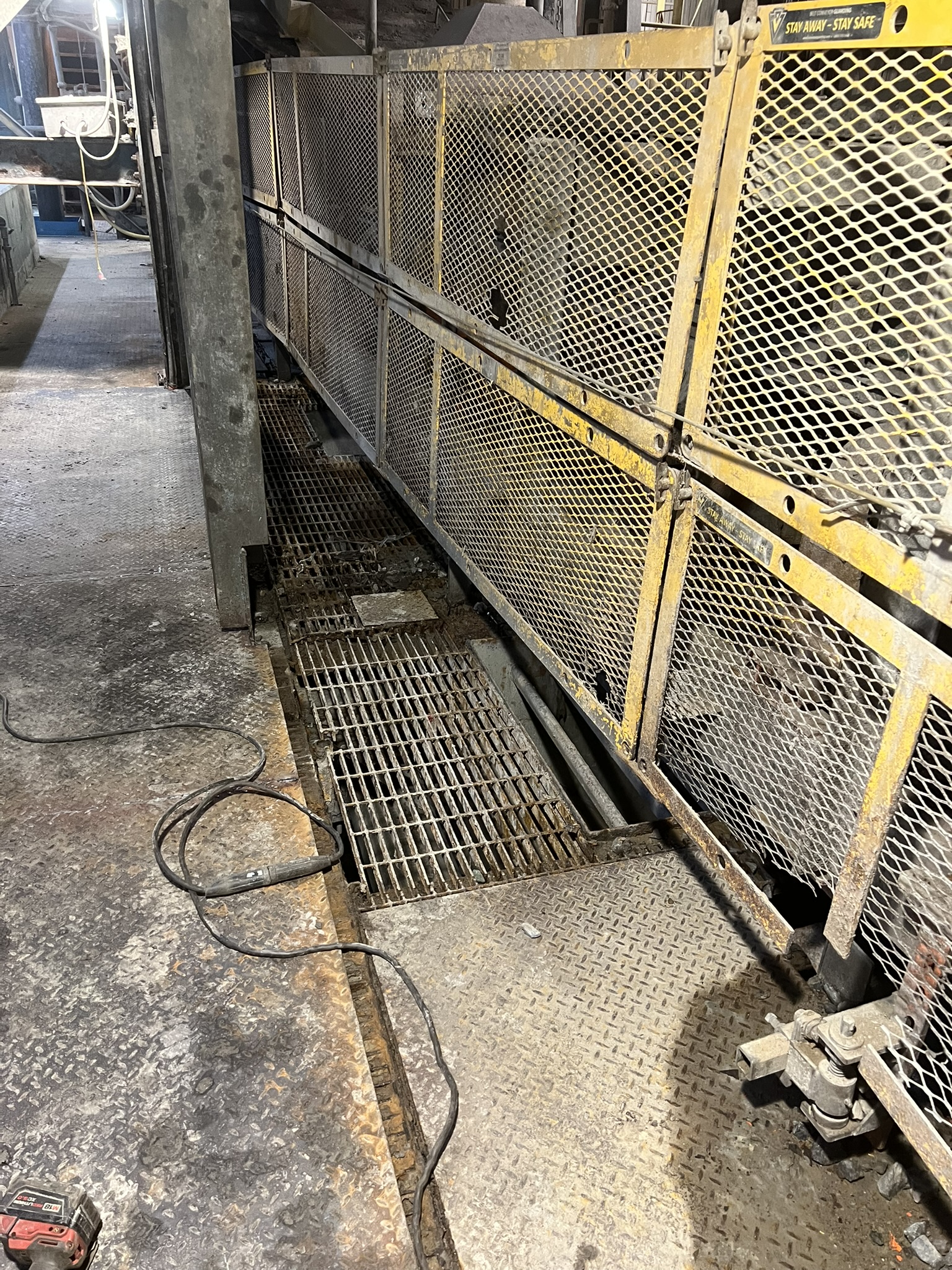 Industrial access walkway and mesh guarding on an active work site